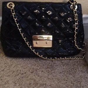 Michael by Micheal Kors Sloan in Black embossed .